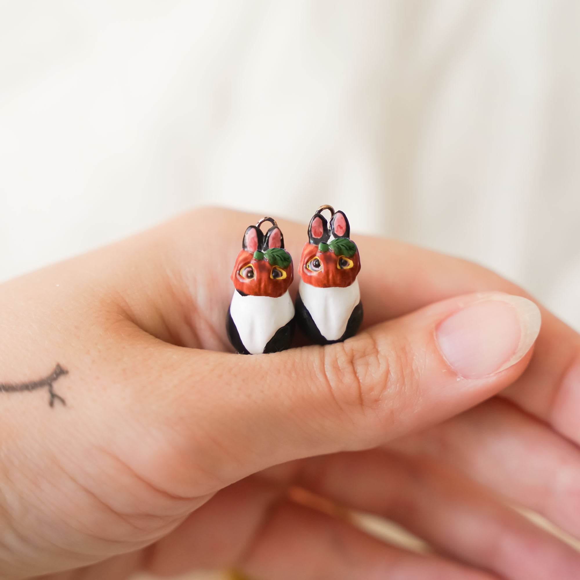 Rabbit earrings with wreath of leaves