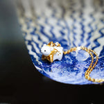 Withe bear with a star pendant