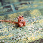 Bear with a fern pendant