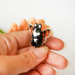 Black and white cat with butterfly wings pendant