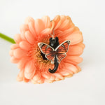 Black and white cat with butterfly wings pendant