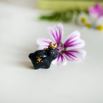 Black bear with the moon pendant