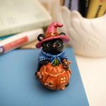 Black Bear with pumpkin's house figurine