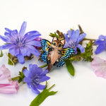 Black-footed cat with butterfly wings pendant