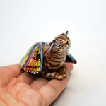 Black footed cat with butterfly wings