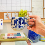 Ceramic cup with a porcelain cat