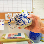 Ceramic cup with a porcelain cat