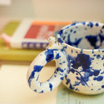 Ceramic cup with a porcelain cat