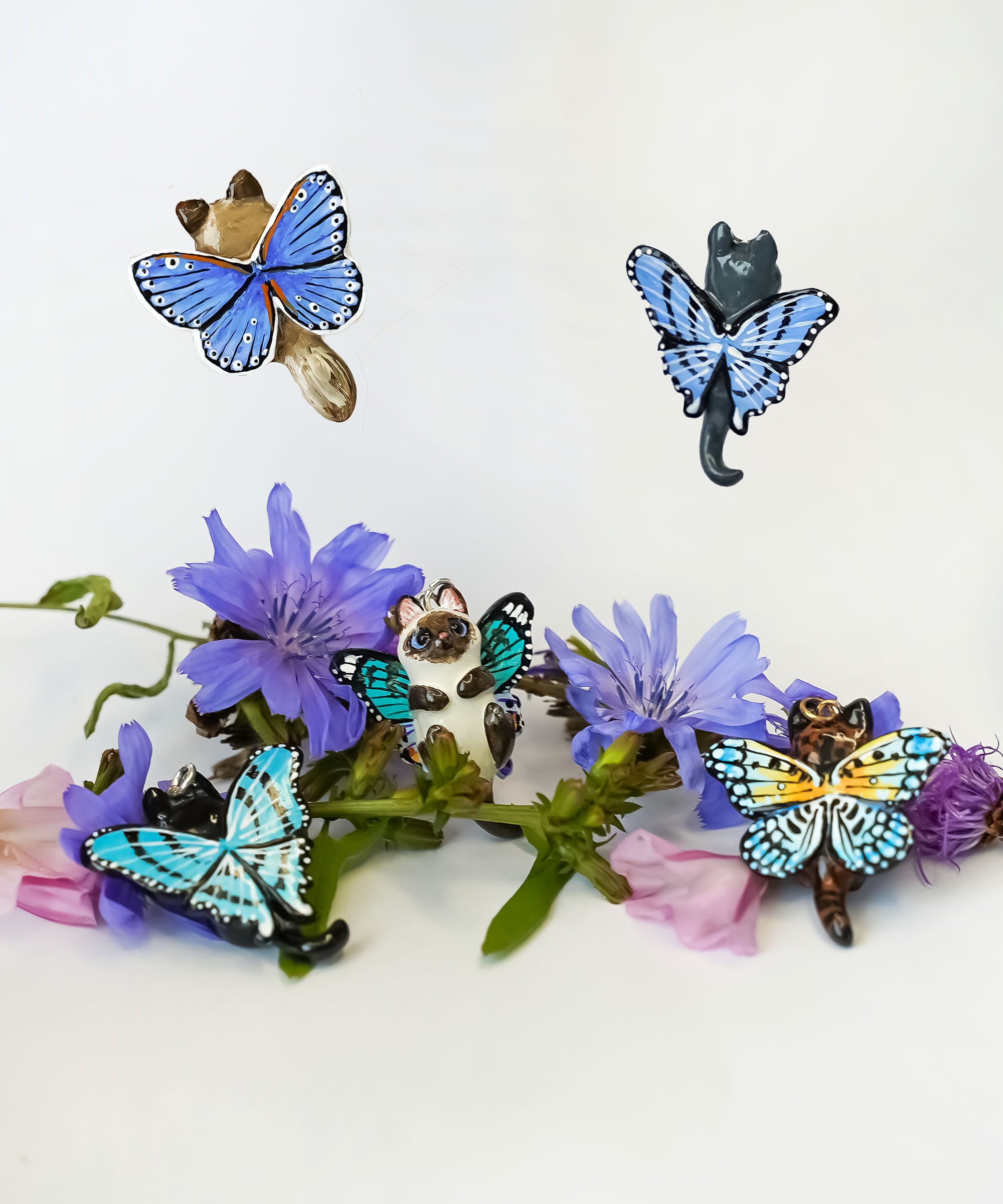 Black-footed cat with butterfly wings pendant