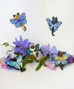Black-footed cat with butterfly wings pendant