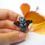British shorthair cat with butterfly wings pendant