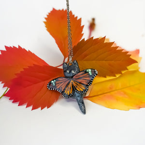British shorthair cat with butterfly wings pendant