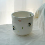 Cup with bumblebees