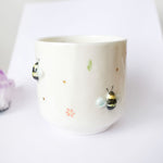 Cup with bumblebees