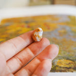 Bunny with a fern pendant