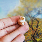 Bunny with a fern pendant