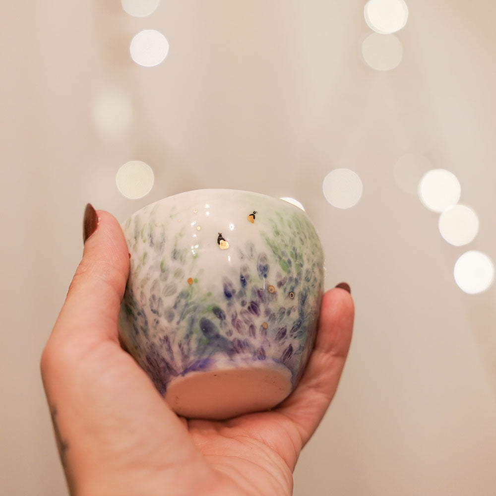 Candle in porcelain cup