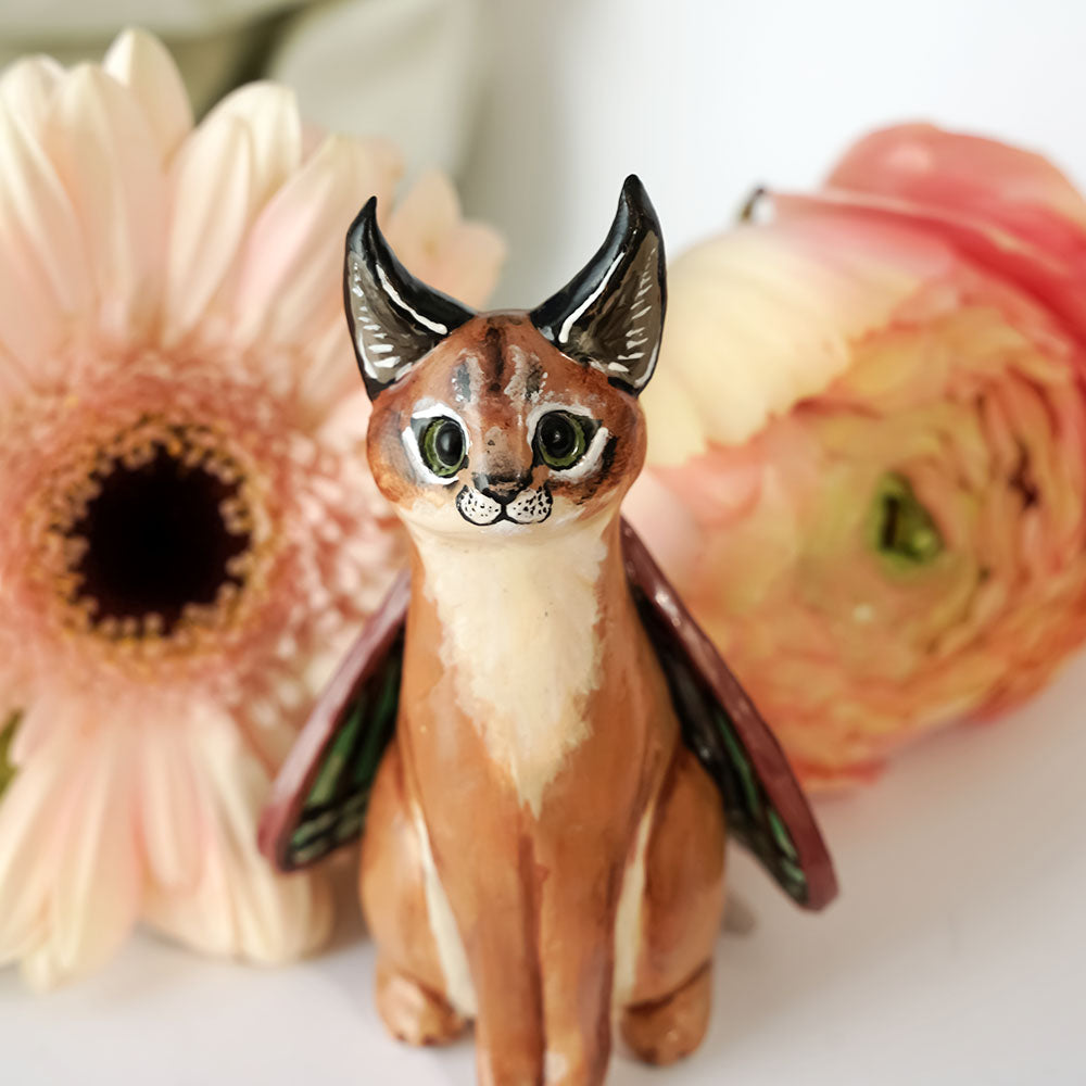 Caracal with butterfly wings