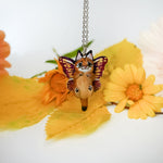 Caracal with butterfly wings pendant