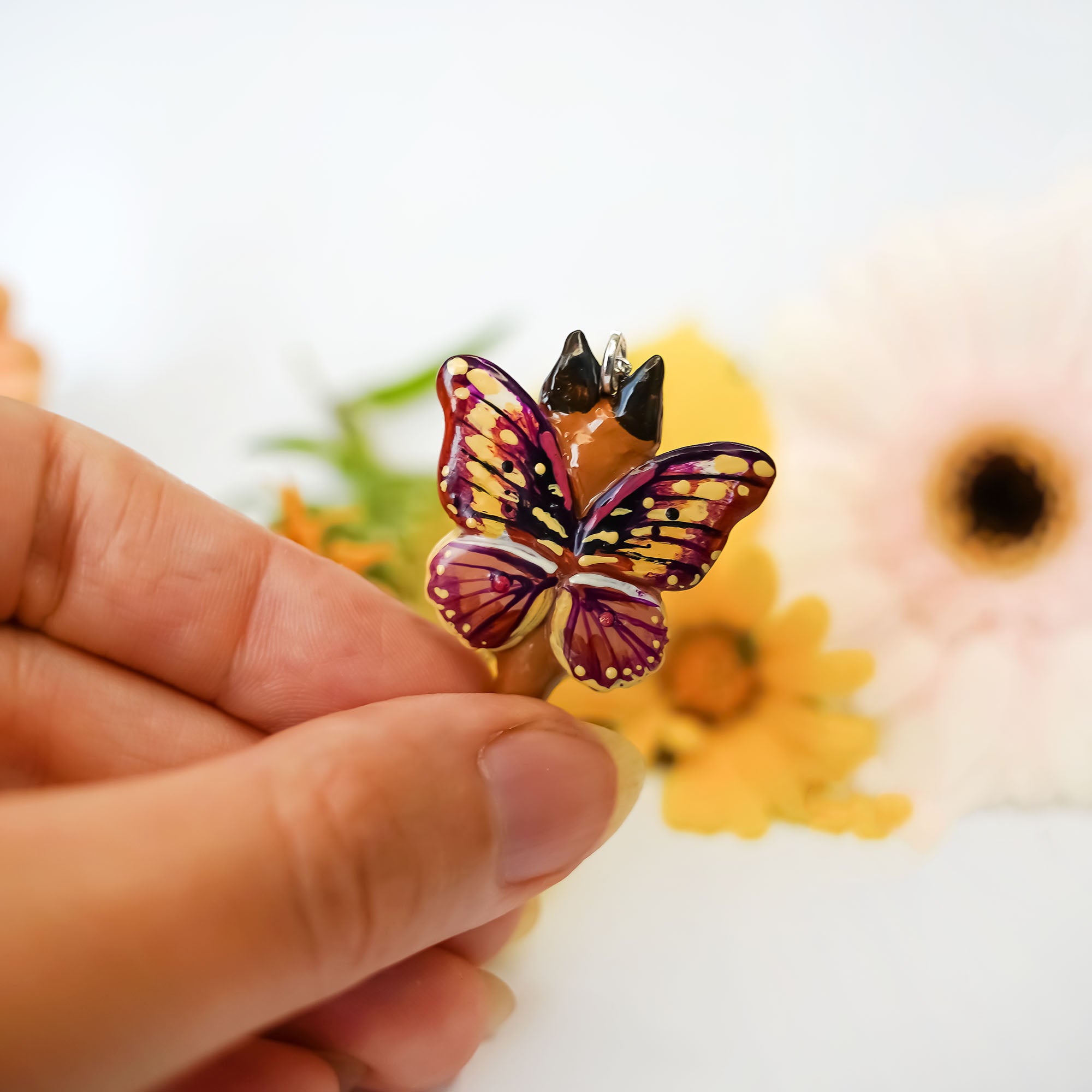 Caracal with butterfly wings pendant