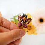 Caracal with butterfly wings pendant