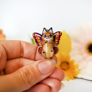 Caracal with butterfly wings pendant