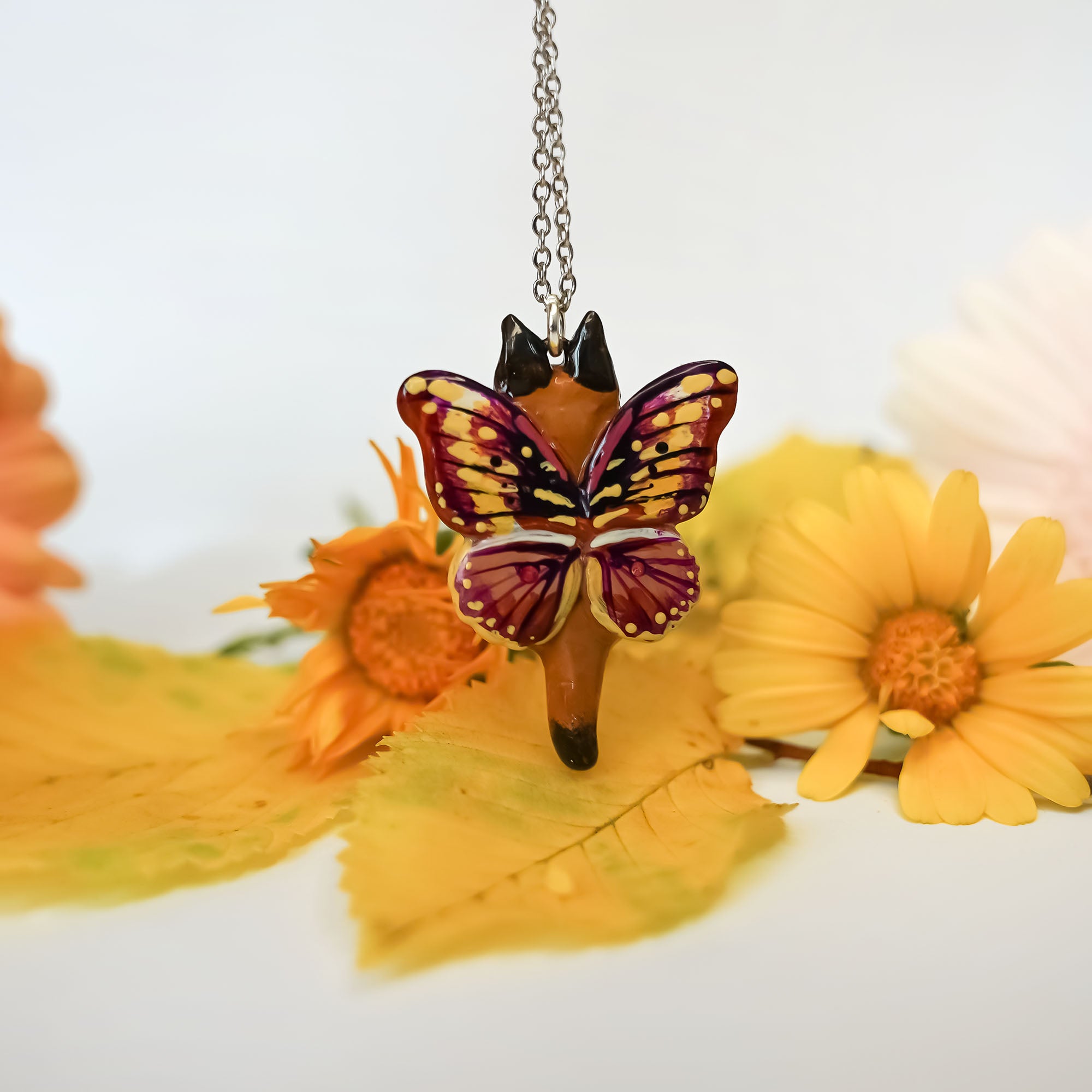 Caracal with butterfly wings pendant