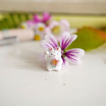 Maneki neko white with a flower pendant