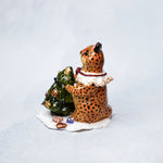 Cheetah with a Christmas tree