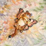 Cheetah with peach butterfly wings