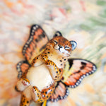 Cheetah with peach butterfly wings