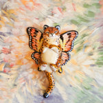 Cheetah with peach butterfly wings