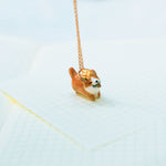 Happy Corgi with a star pendant