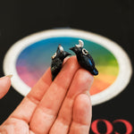 Crow with a silver moon pendant