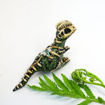 Dilophosaurus fossil figurine