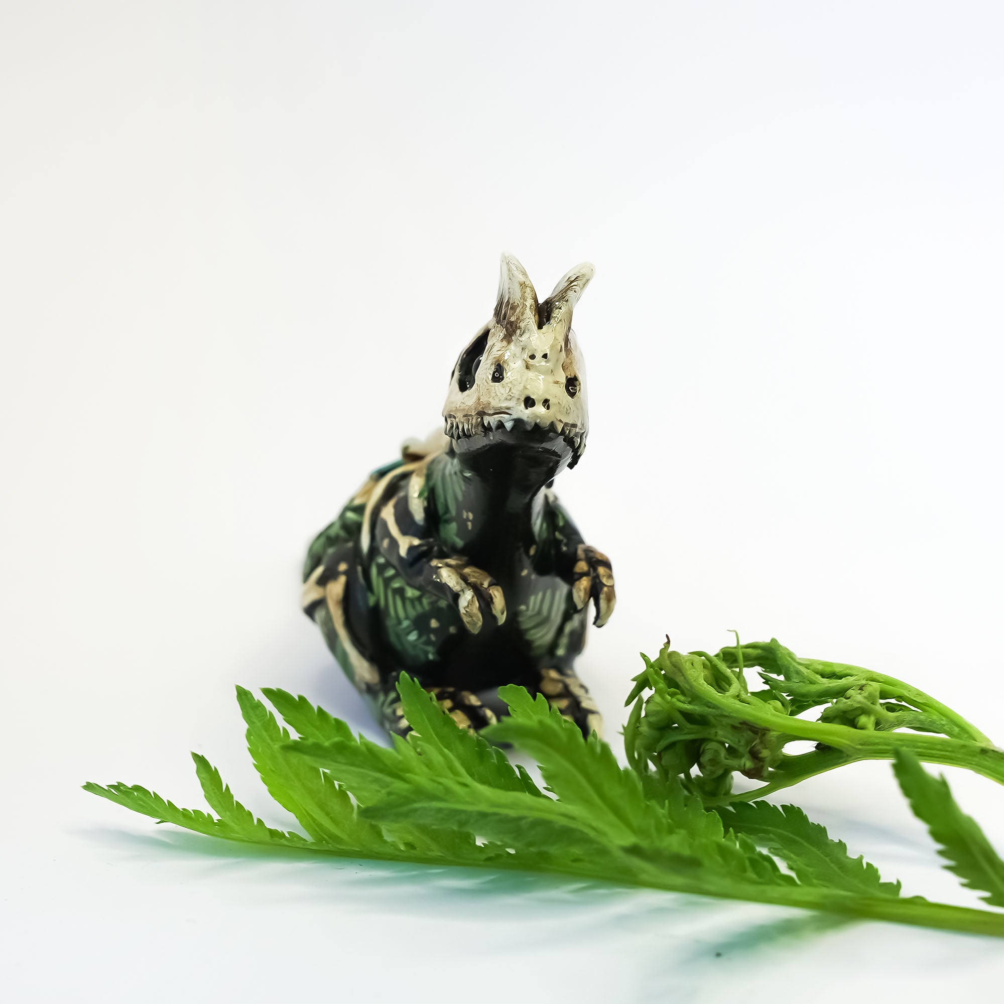 Dilophosaurus fossil figurine