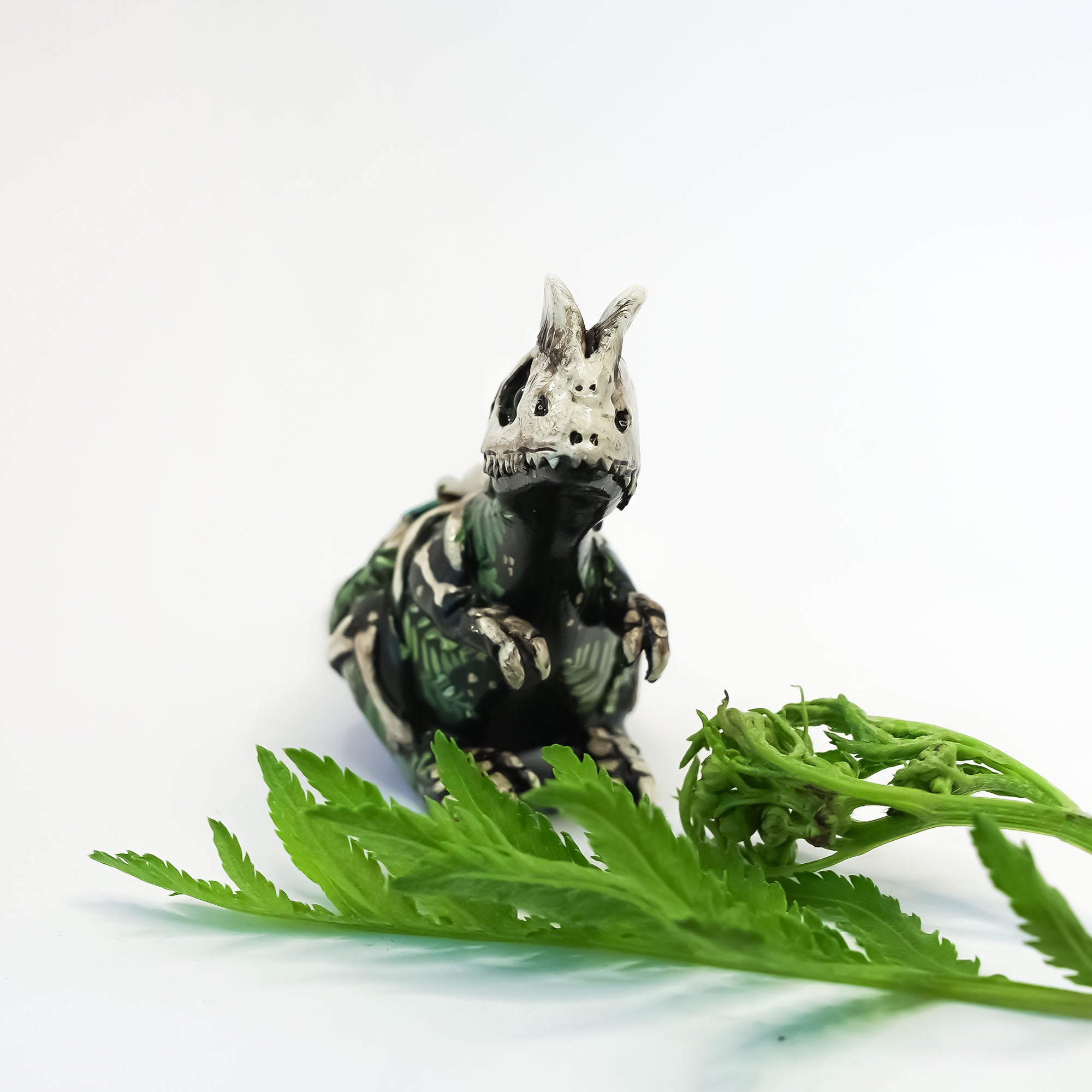 Dilophosaurus fossil figurine