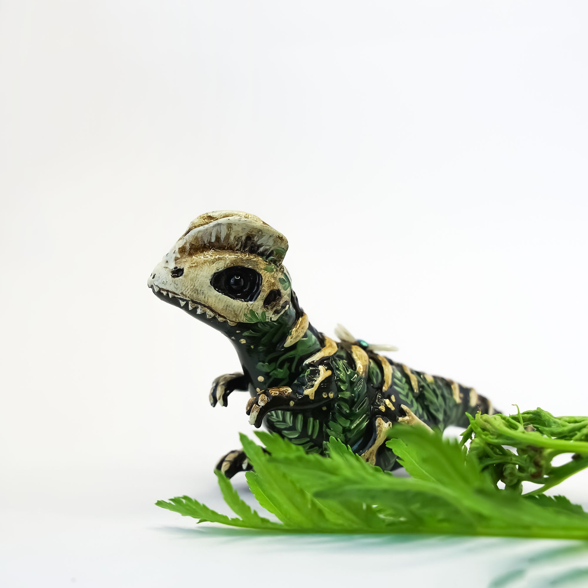 Dilophosaurus fossil figurine