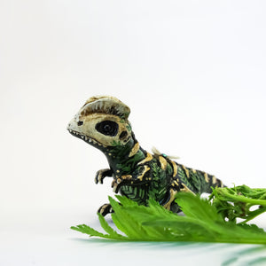 Dilophosaurus fossil figurine