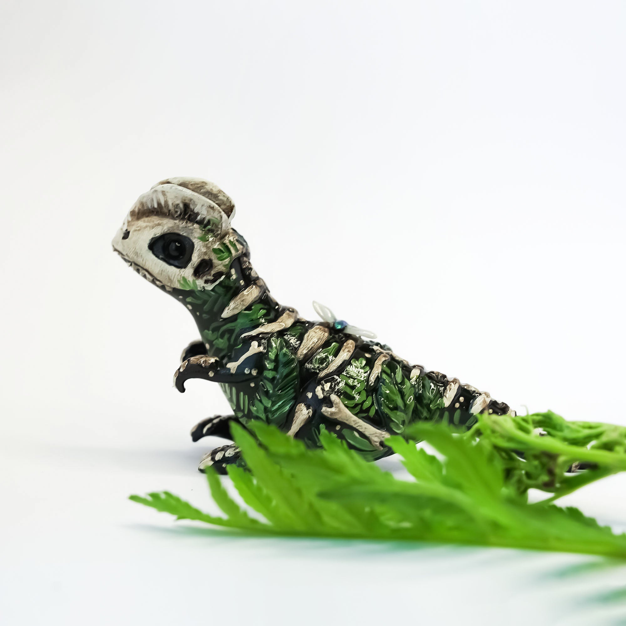 Dilophosaurus fossil figurine