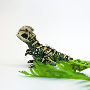 Dilophosaurus fossil figurine