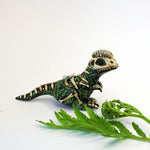 Dilophosaurus fossil figurine