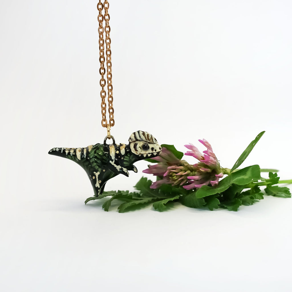 Dilophosaurus fossil pendant