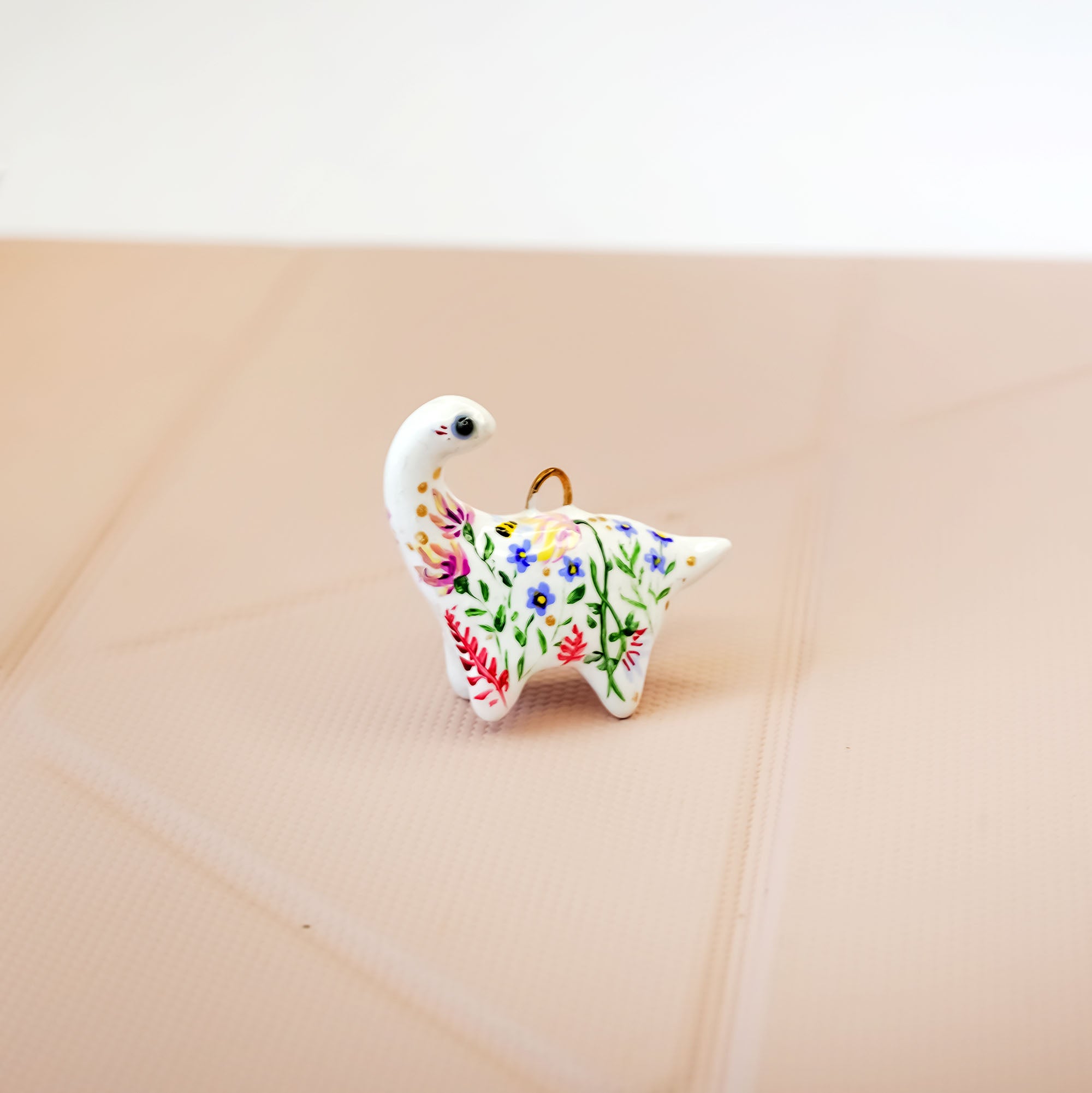 Dinosaur with flowers pendant