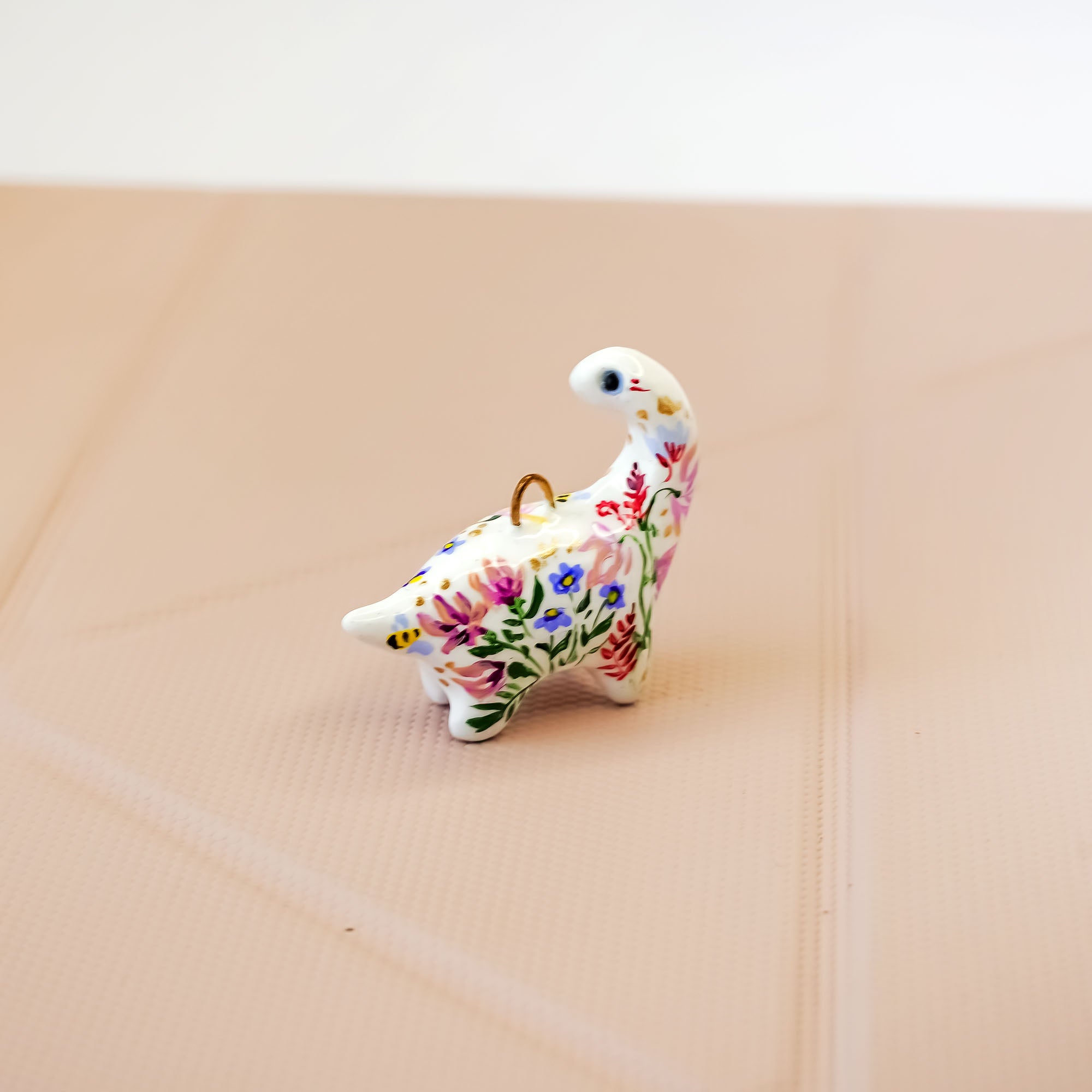 Dinosaur with flowers pendant