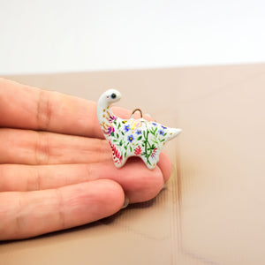 Dinosaur with flowers pendant