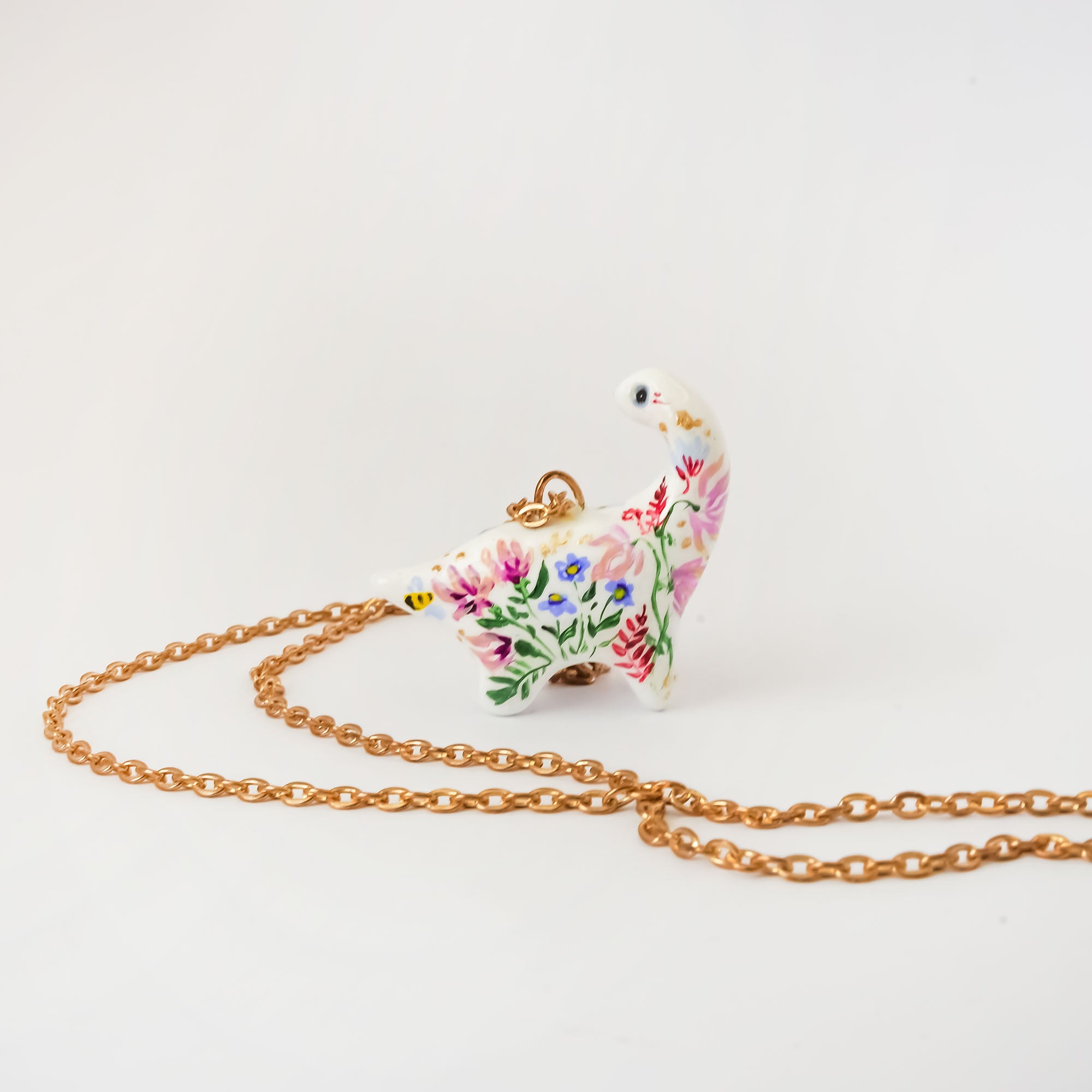 Dinosaur with flowers pendant
