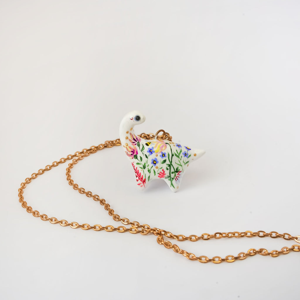 Dinosaur with flowers pendant