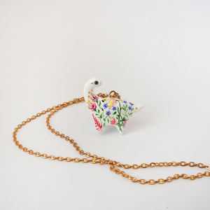 Dinosaur with flowers pendant