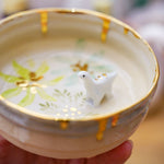 Small ceramic aquarium with a porcelain dinosaur